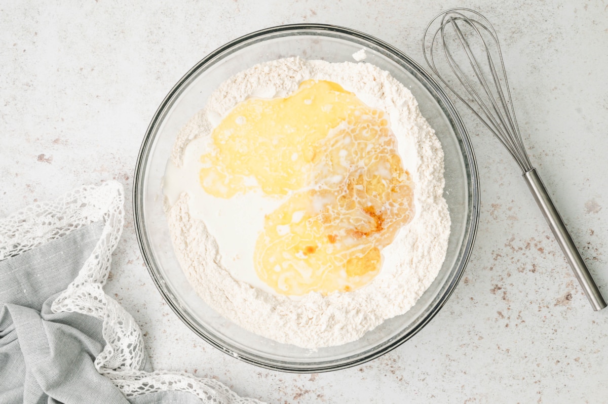 flour, eggs and buttmilk ready to mix in a bowl.