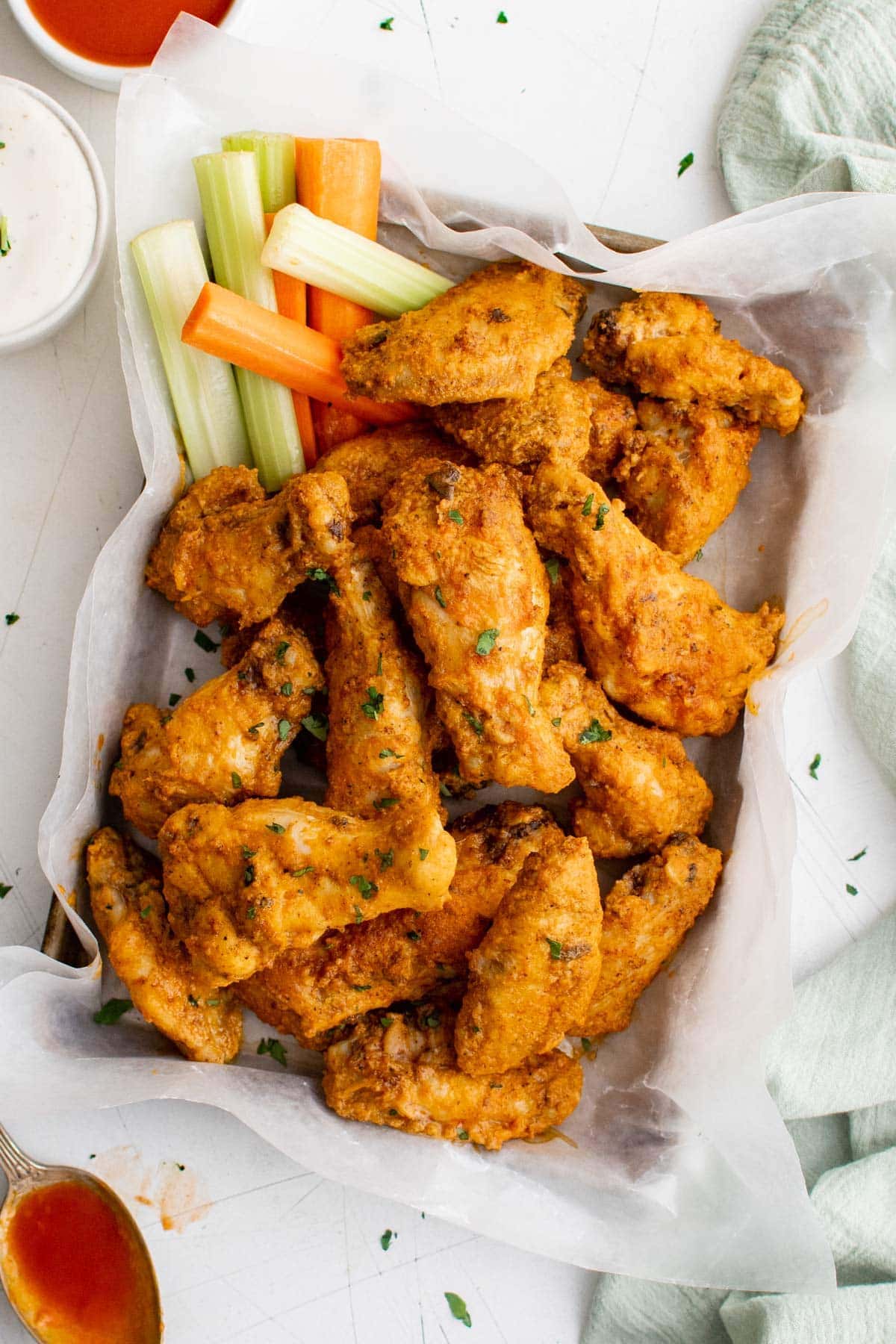 basket of buffalo wings, celery, carrot sticks