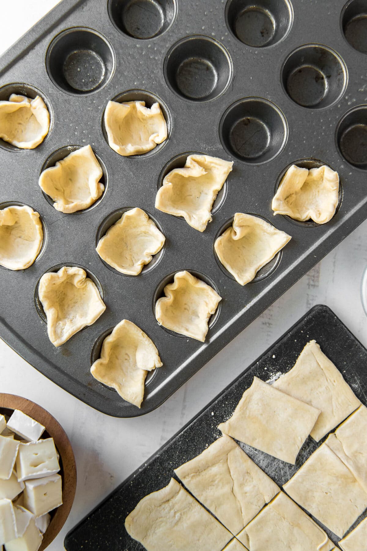 Small pieces of crecent dough pressed into muffin cups.