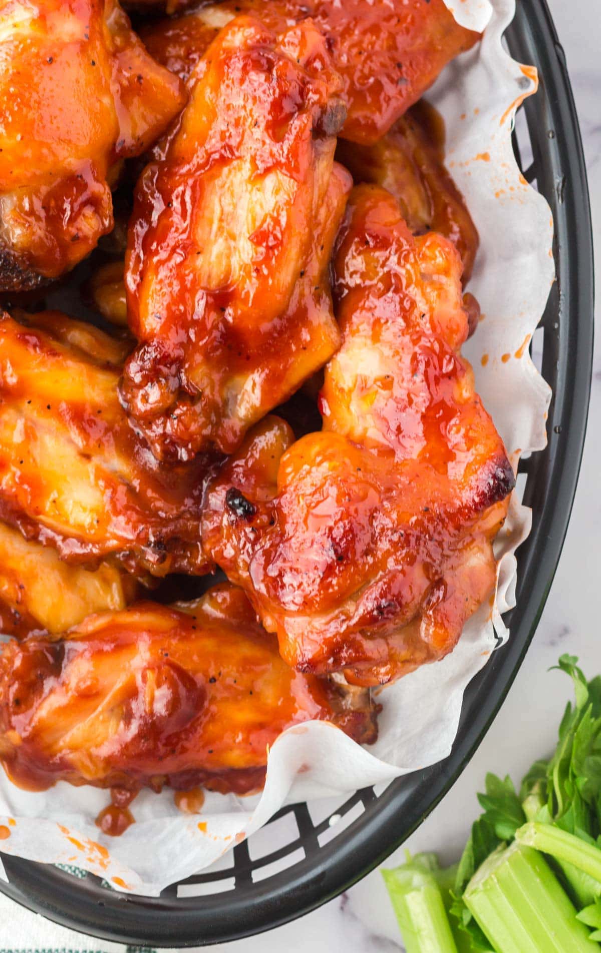 chicken wings with bbq sauce in a basket
