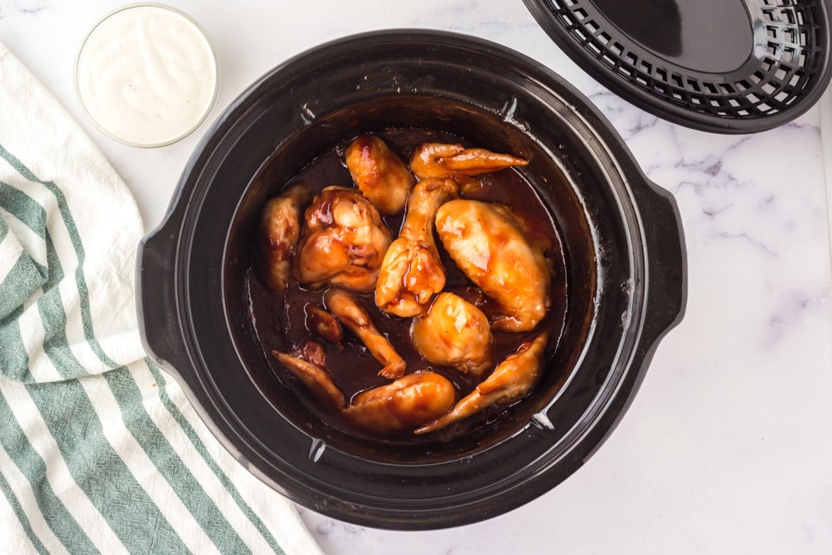 chicken wings and bbq sauce in slow cooker