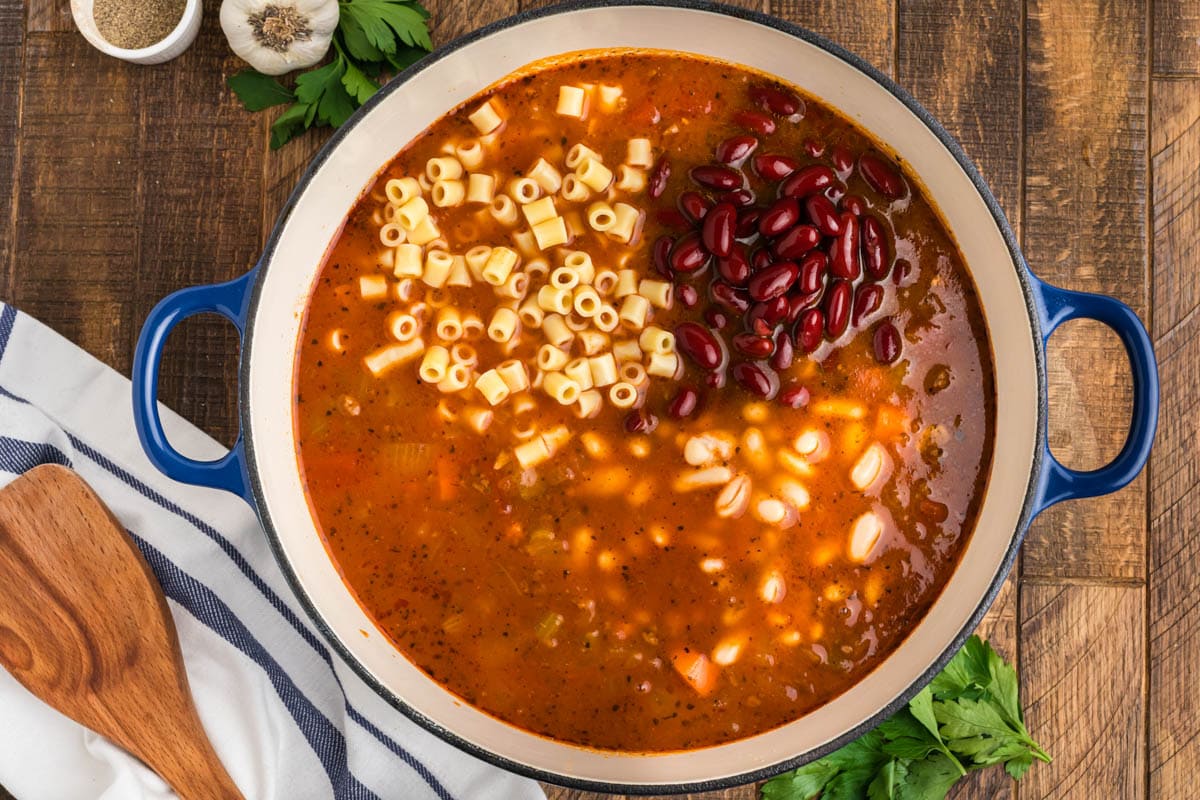 Tomato broth with kidney beans, small pasta and vegetables.