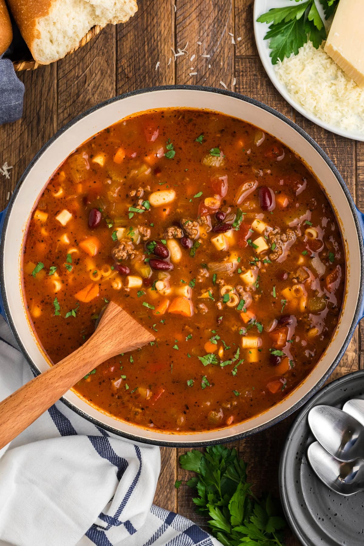 Pot of Pasta Fagioli Soup with a wooden spoon.