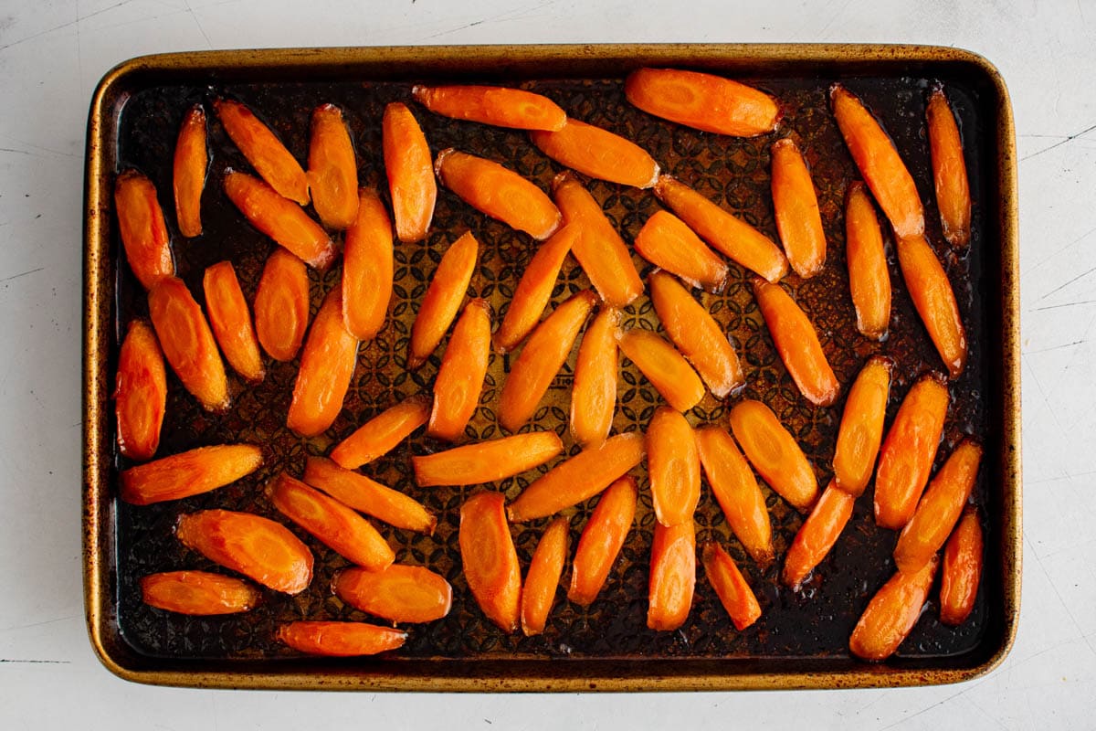 Roasted carrots on a baking sheet.
