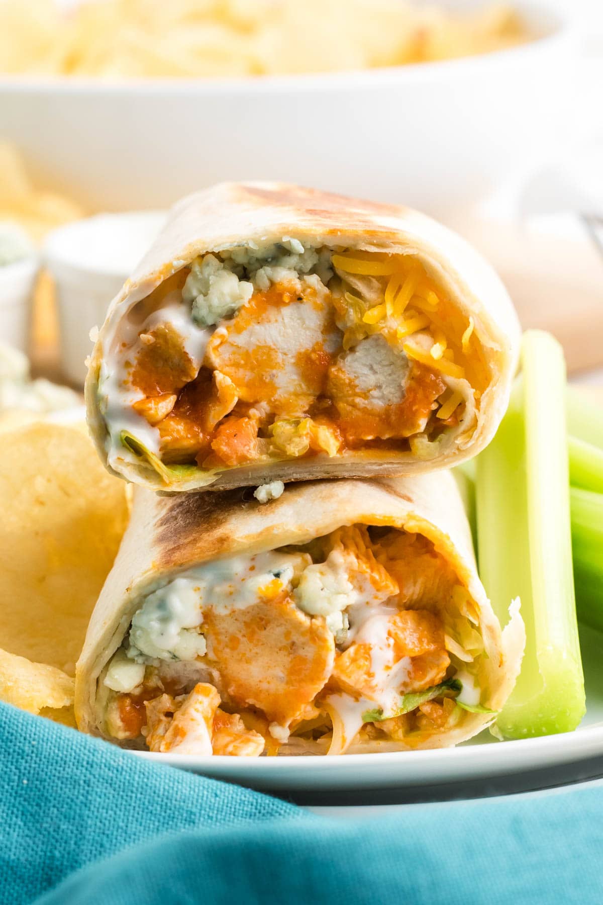 Two buffalo chicken wraps stacked.