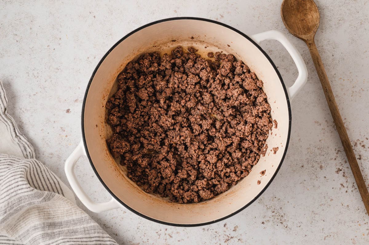 Ground beef browned in a large pot.