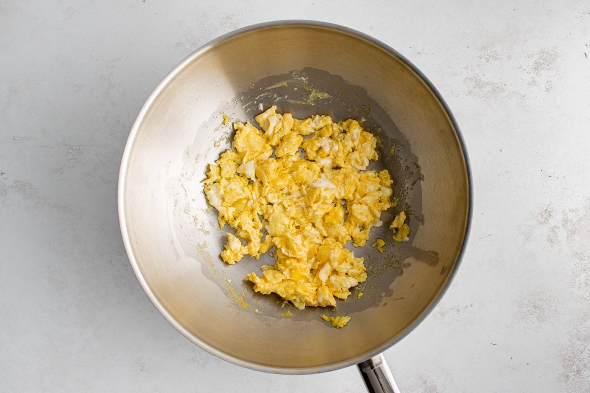 Scrambled eggs in a wok.