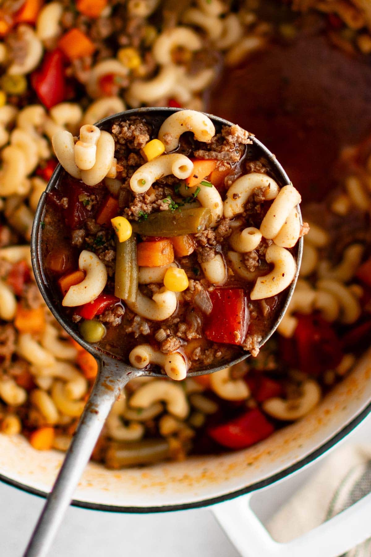 Goulash soup in a large soup pot with.a ladle.