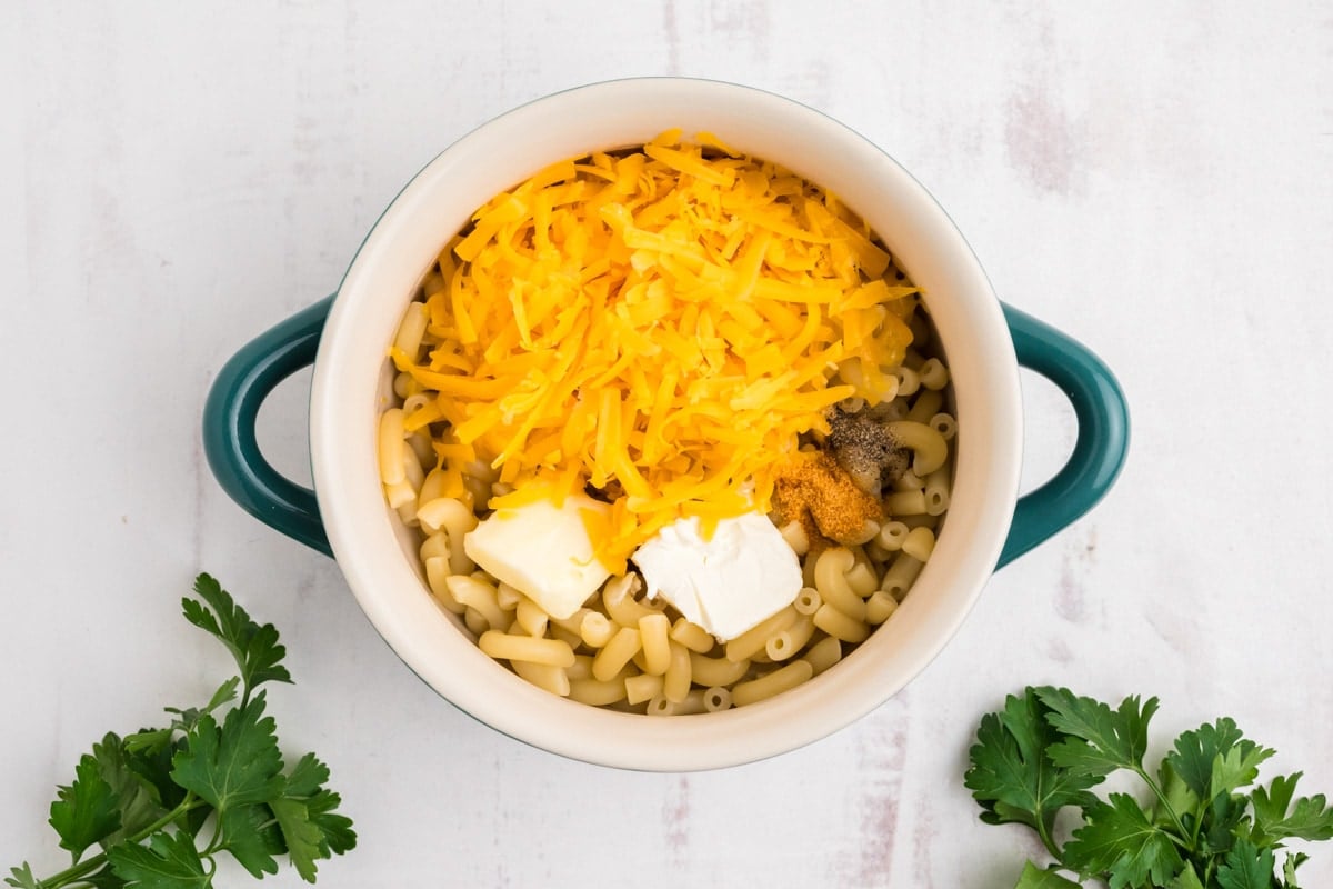 Cooked macaroni, shredded cheese and cream cheese.