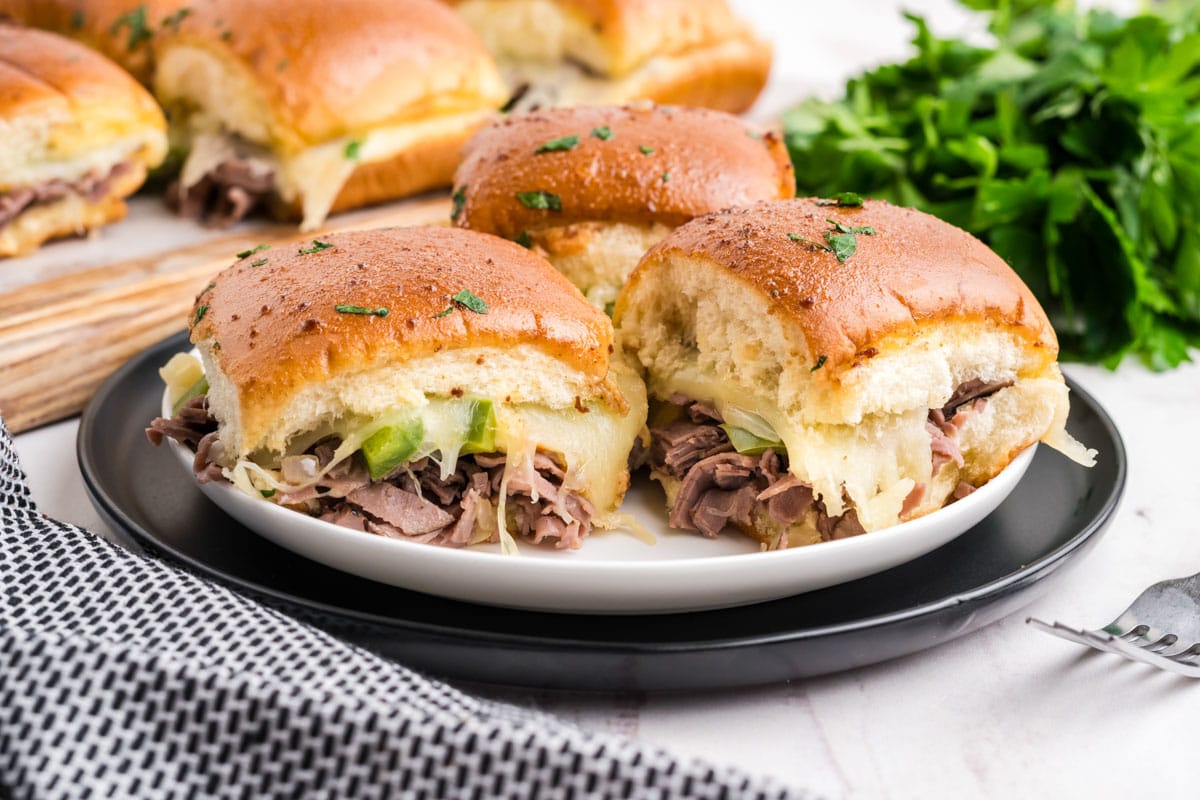 Philly cheesecake sliders on a plate.