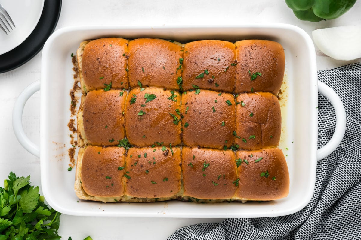 Dozen rolls in a white baking dish.