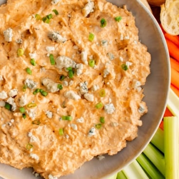 Buffalo chicken dip in a white bowl.