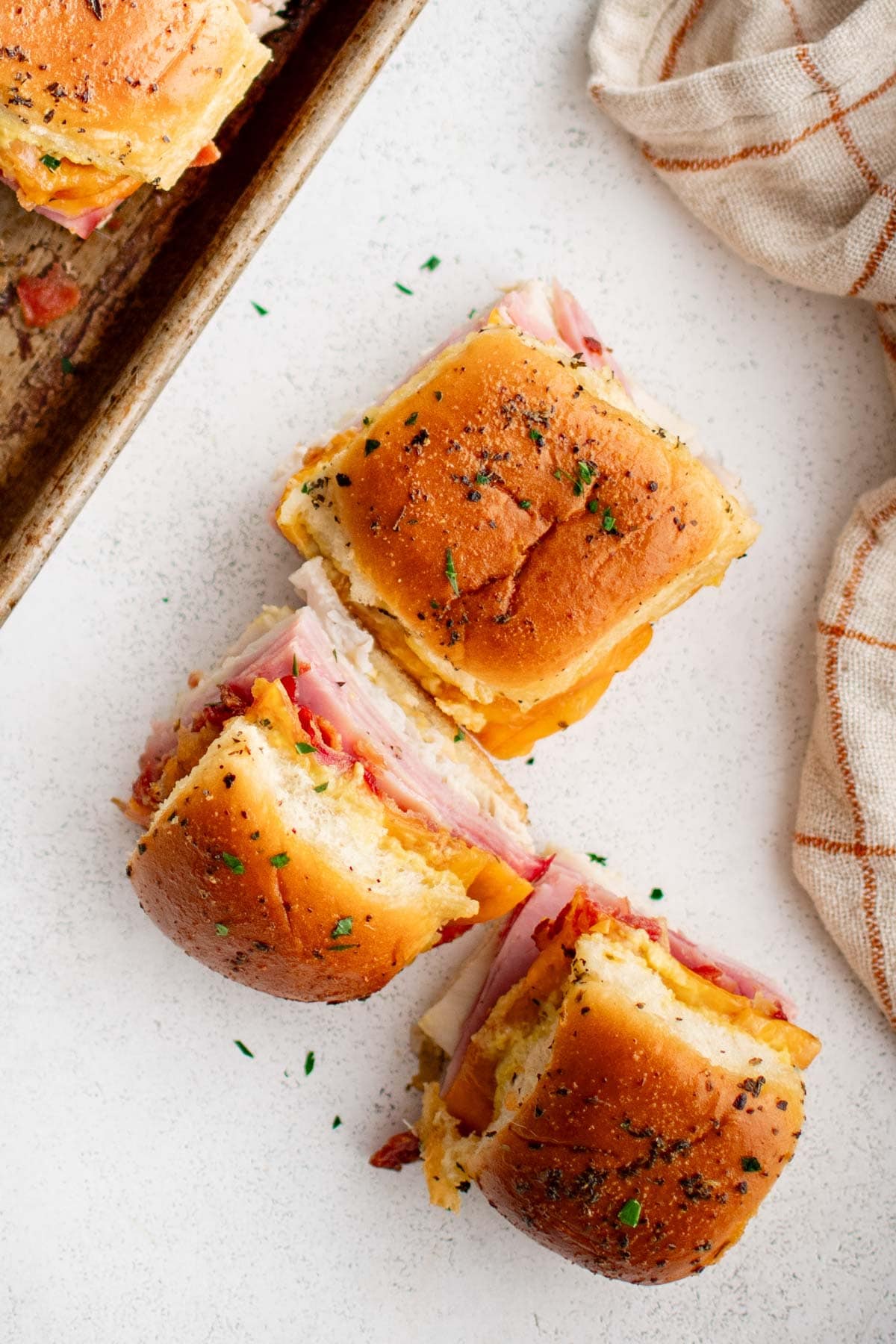 3 mini slider sandwiches with turkey, ham and bacon.