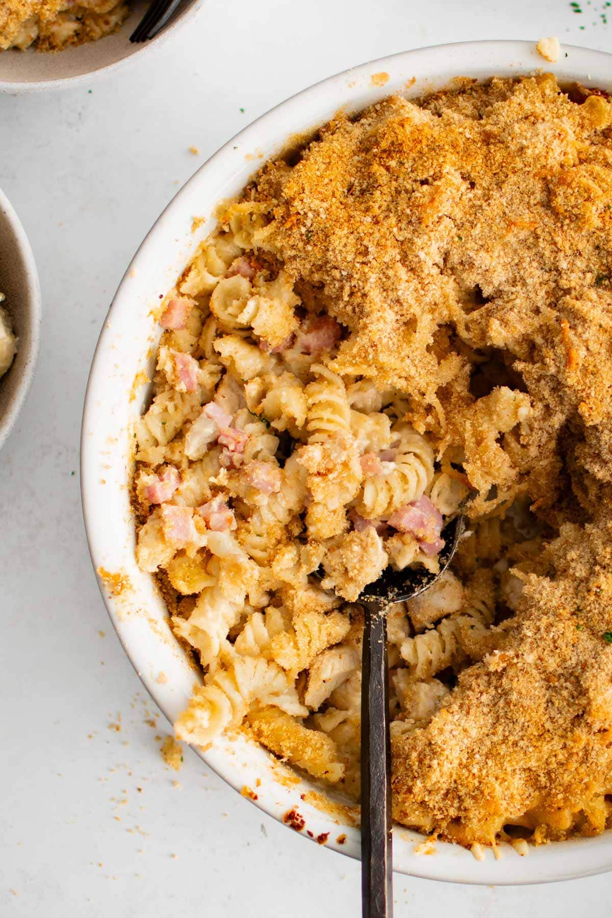 Pasta casserole with chicken and ham, and breadcrumb topping.
