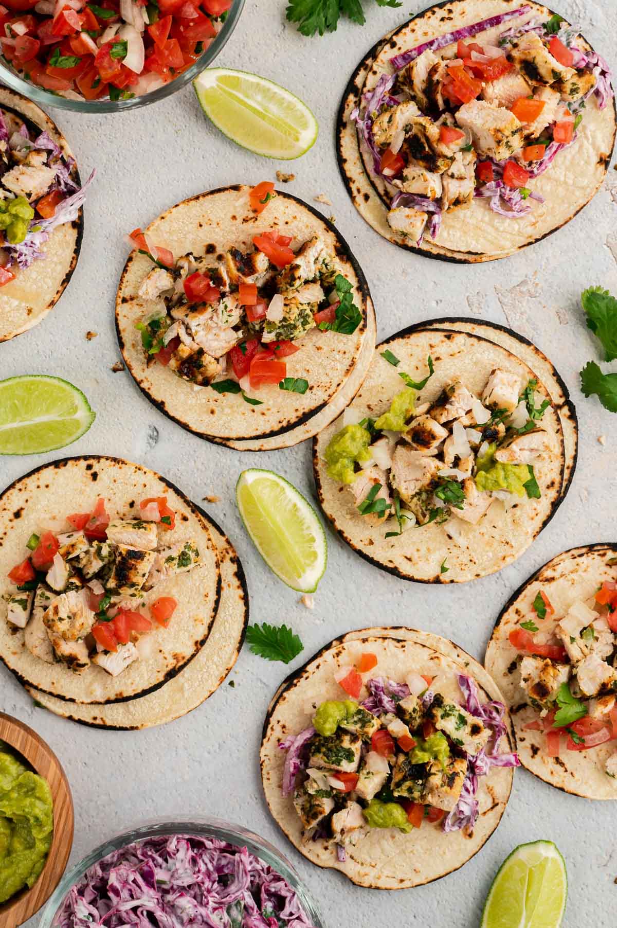 Corn tortillas with chicken, pico de gallo and limes. 