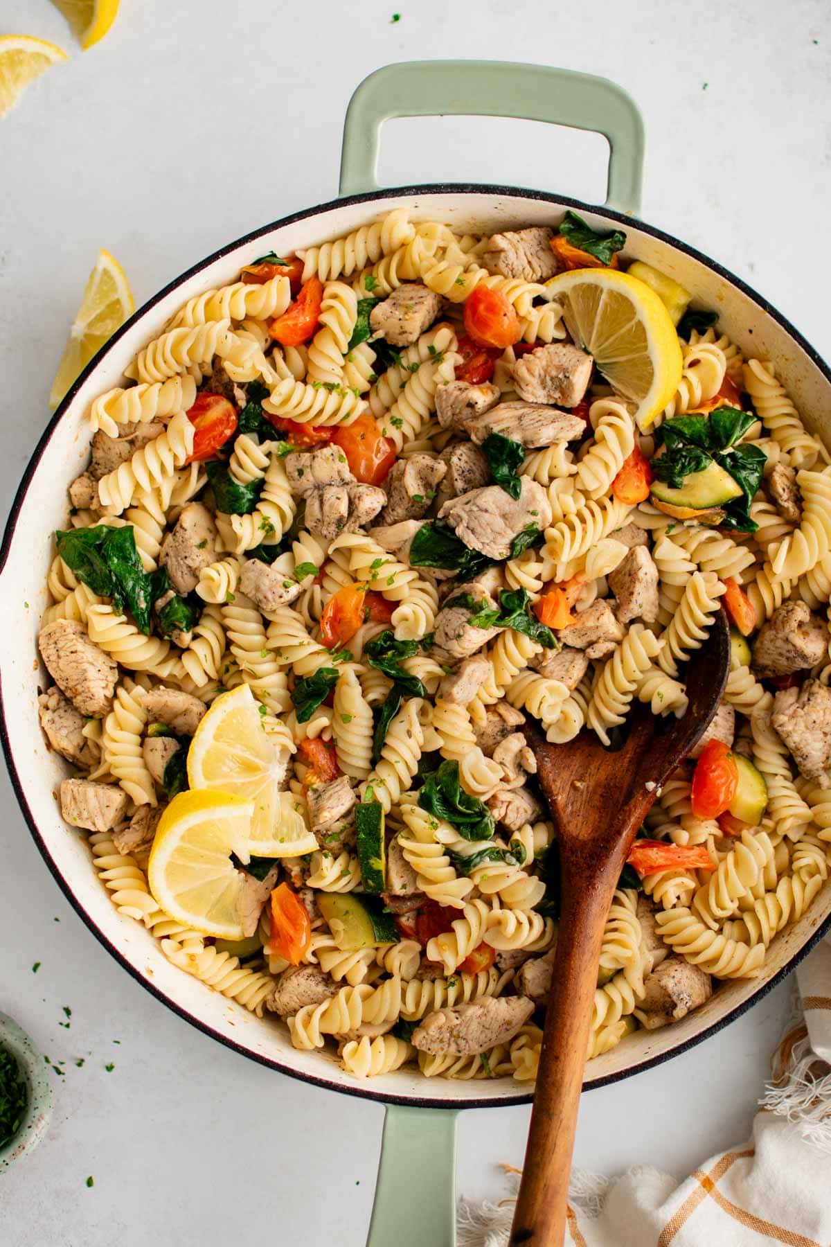 Large skillet with pasta, chicken and vegetables.