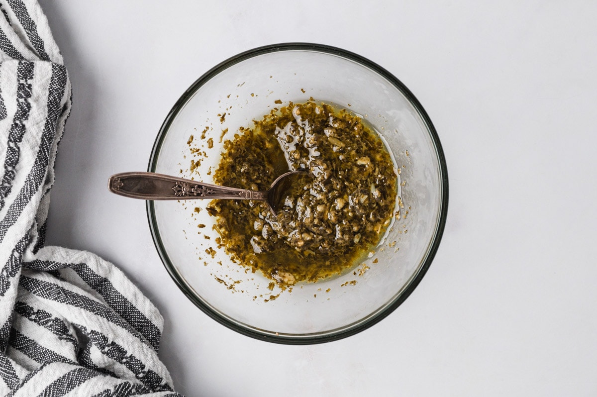 homemade pesto in a clear glass bowl.