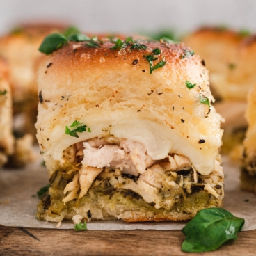 Chicken pesto slider on a spatula.