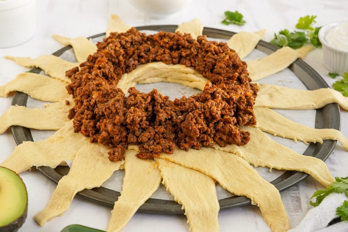 crescent roll triangles topped with taco meat