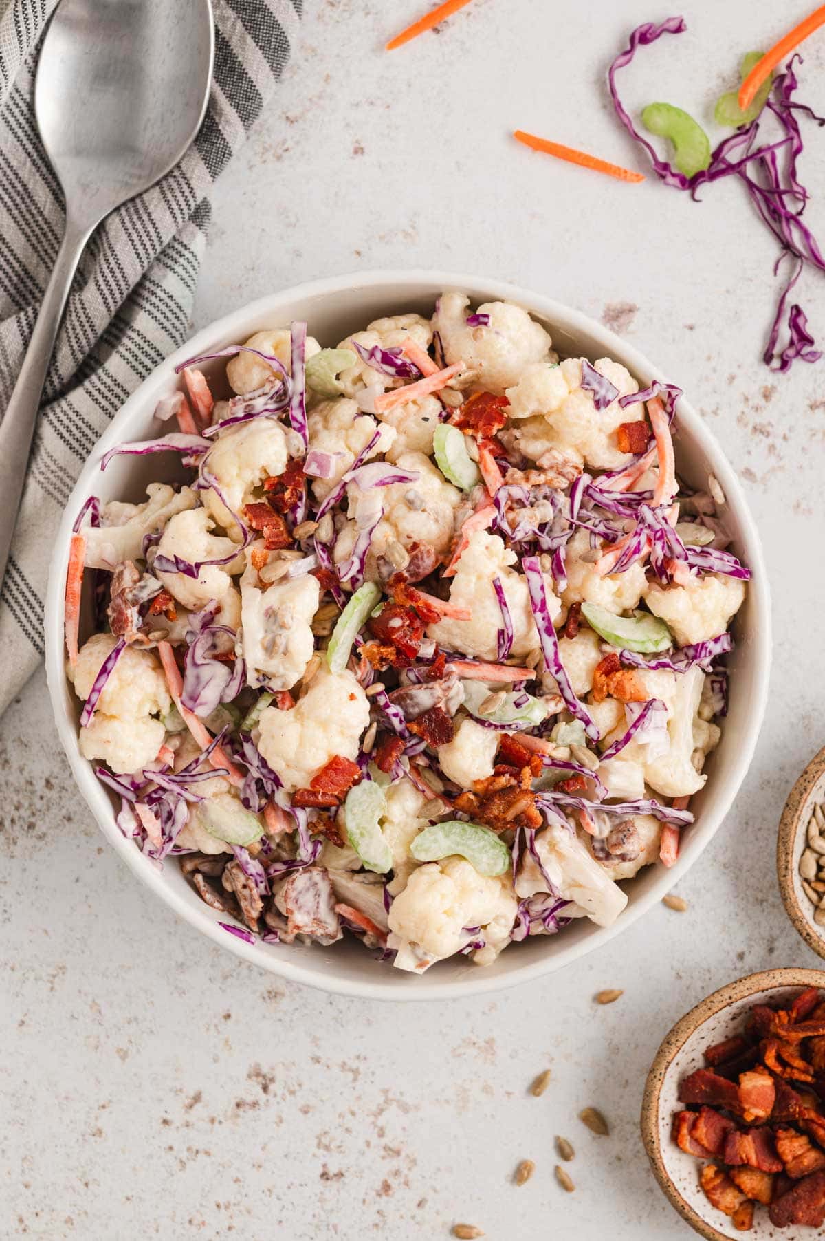 Cauliflower salad with red cabbage and bacon.