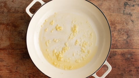 Garlic and melted butter in a skillet.