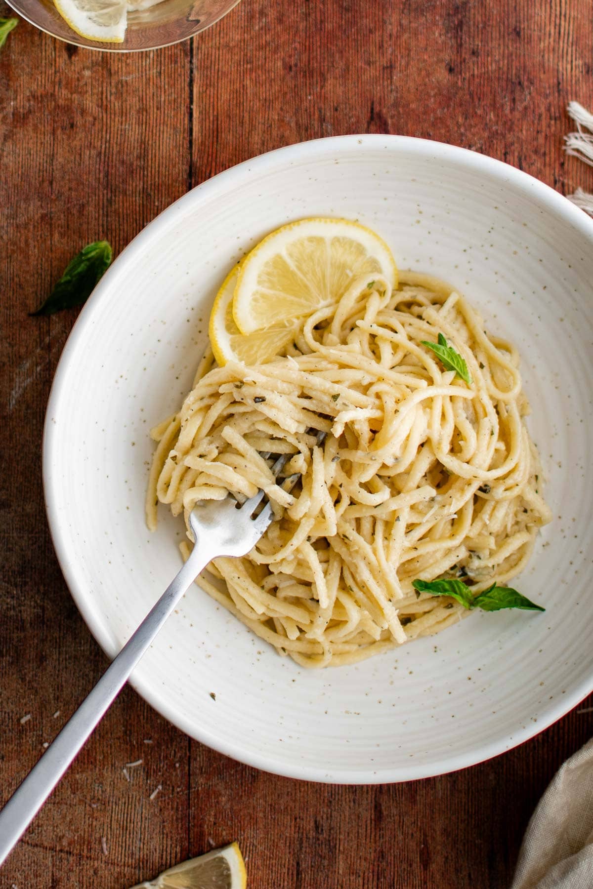 Bowl of linguine with lemon and basil.