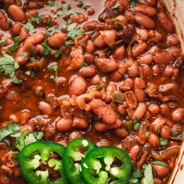 Mexican pinto beans with jalapeno slices.