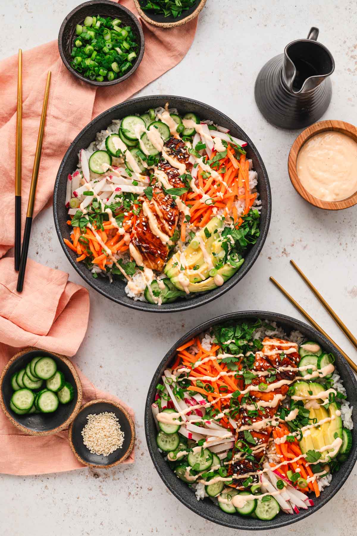 Two salmon bowls with chopsticks.