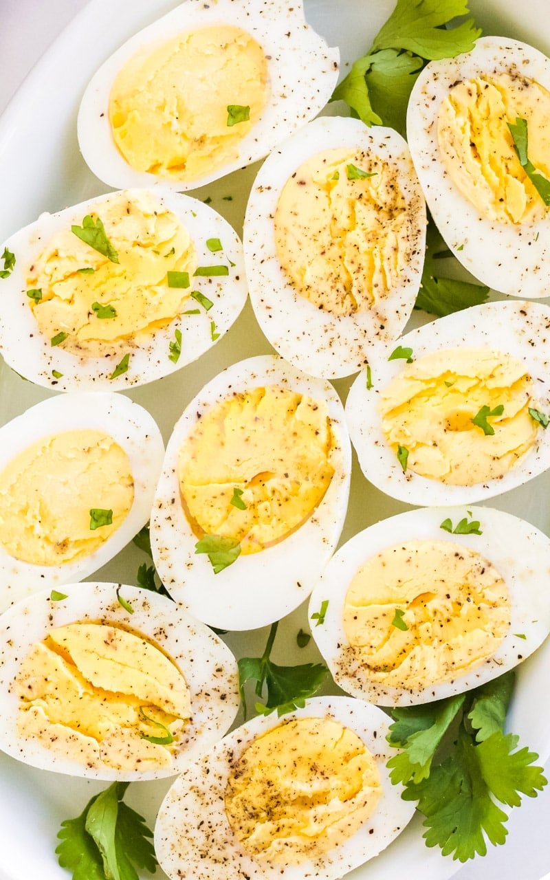 Eggs, sliced in half revealing creamy yellow centers.