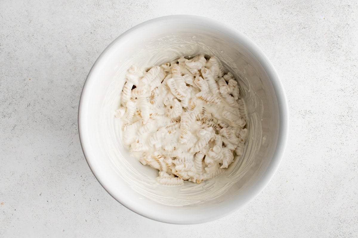 Pasta in a creamy sauce in a bowl.