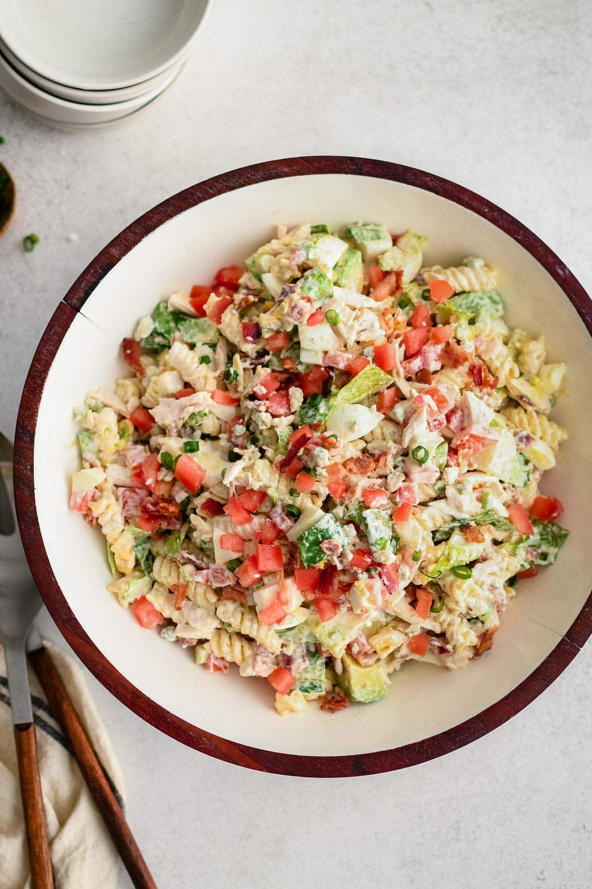 Chicken cobb pasta salad in a large bowl.