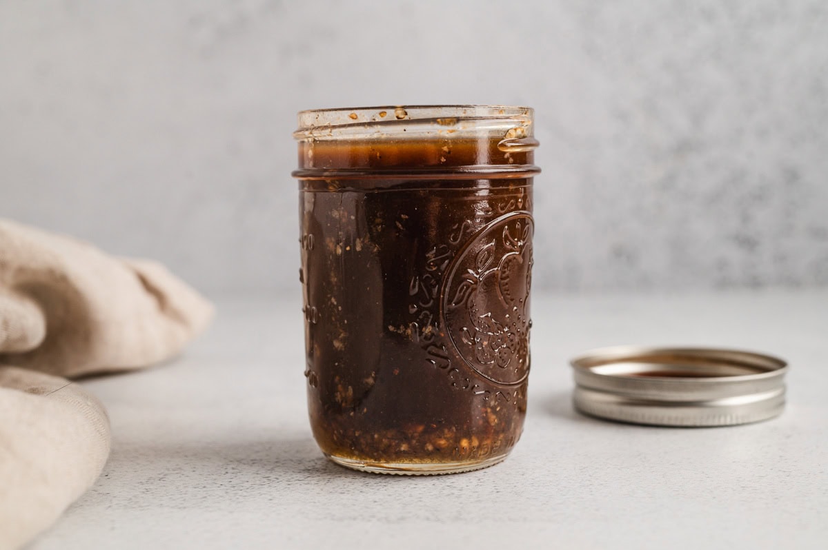 Balsamic vinaigrette in a small mason jar.