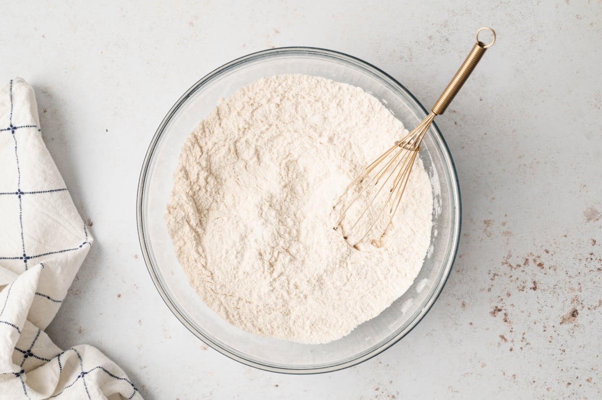 Flour mixture in a bowl with a hand mixer.