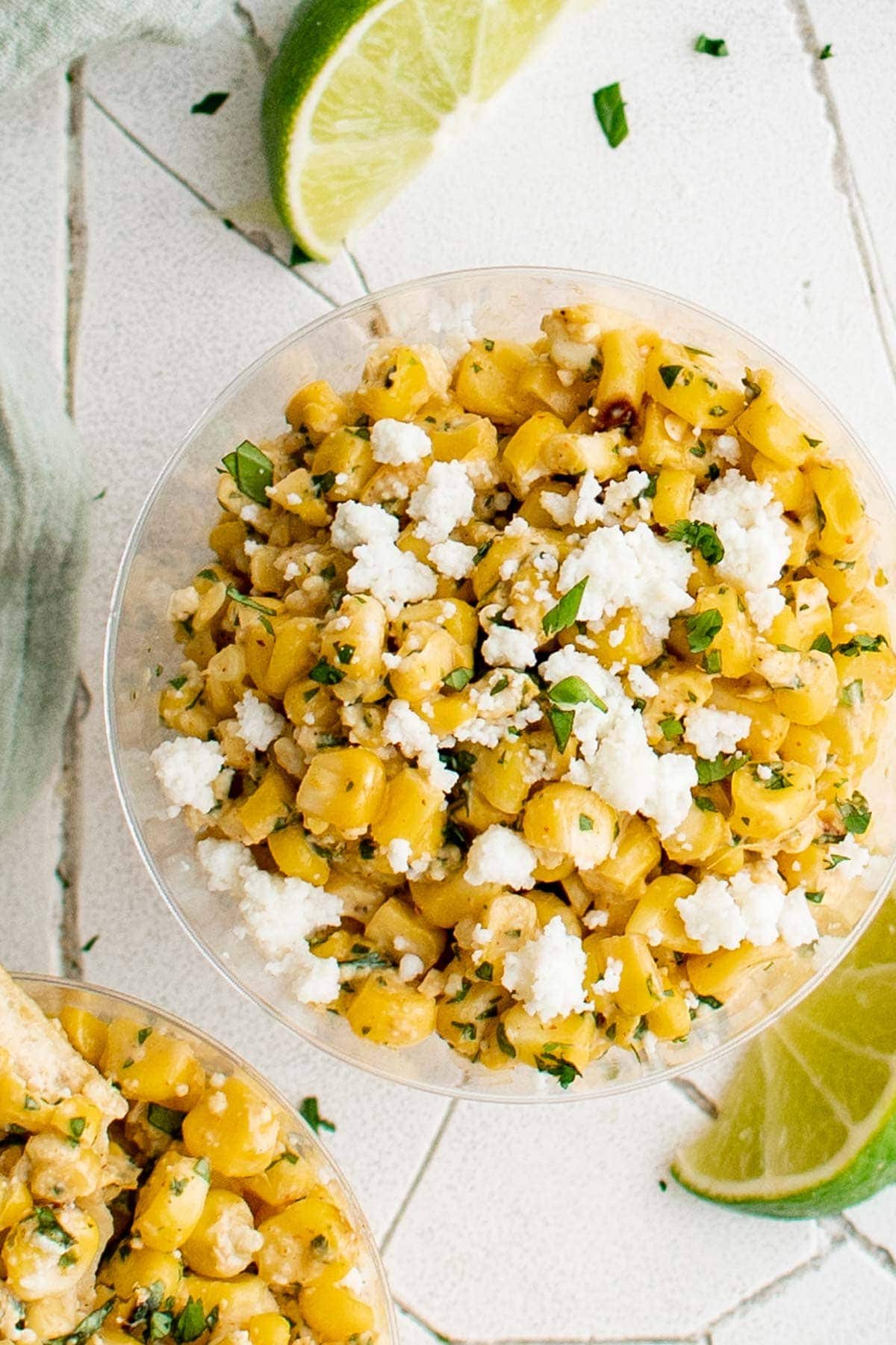Elote cups filled with street corn salad.
