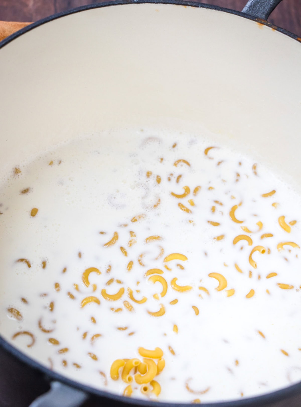 Macaroni simmering in milk.