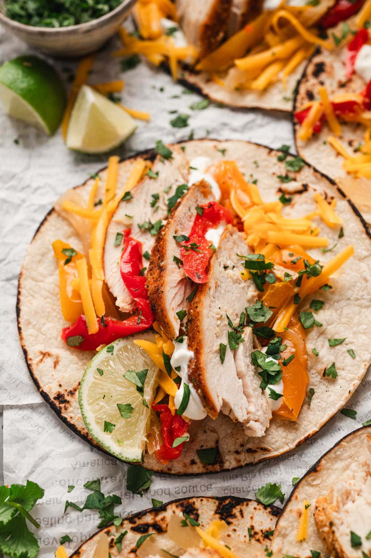 flour tortilla with sliced chicken and peppers.