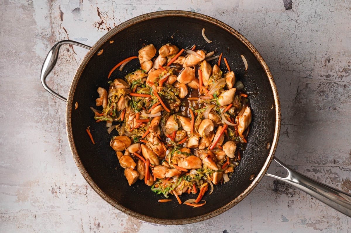 Chicken, veggies, and sauce in saute pan