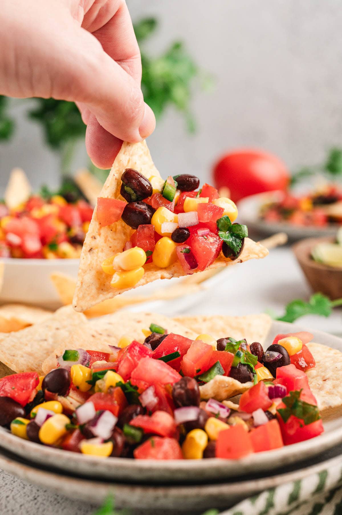 Corn and black bean salsa on a tortilla chip.