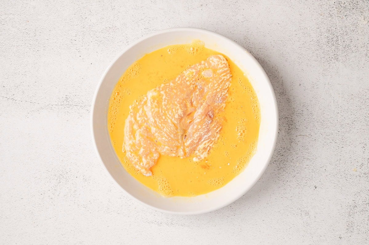 Chicken cutlet dredged in egg