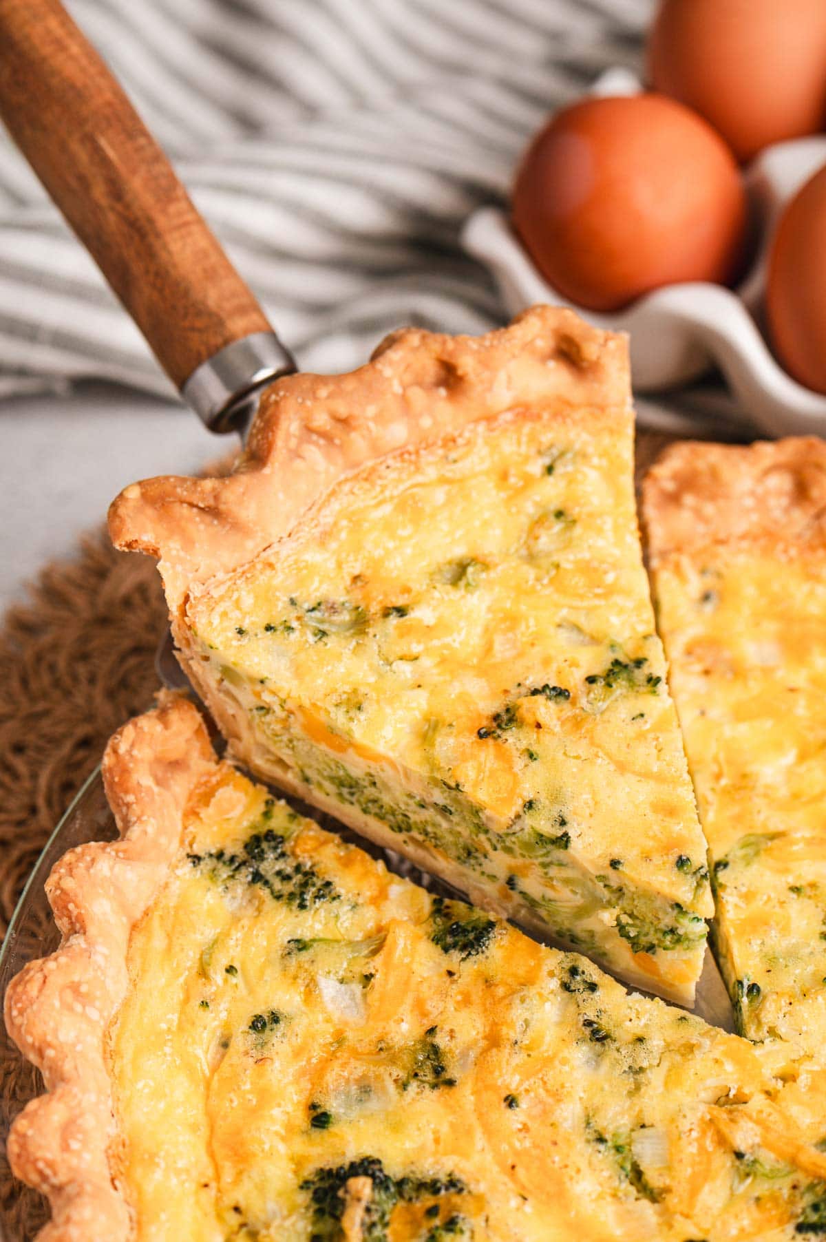 Slice of broccoli cheddar quiche.