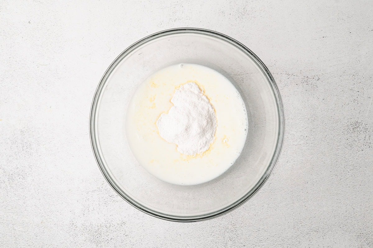 Buttermilk and vanilla pudding mix in a glass bowl.