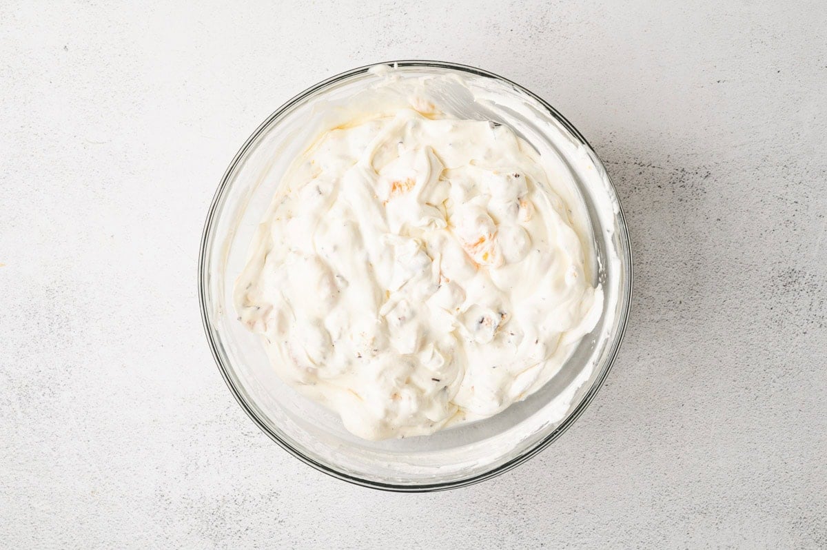 Cookie salad mixed in a glass bowl.