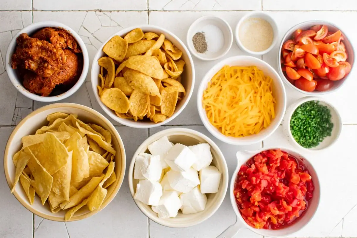 ingredients for spicy sausage dip along with tortilla chips and frito corn chips