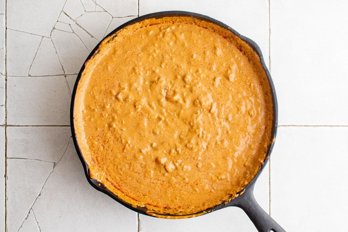 chorizo sausage dip in a cast iron skillet