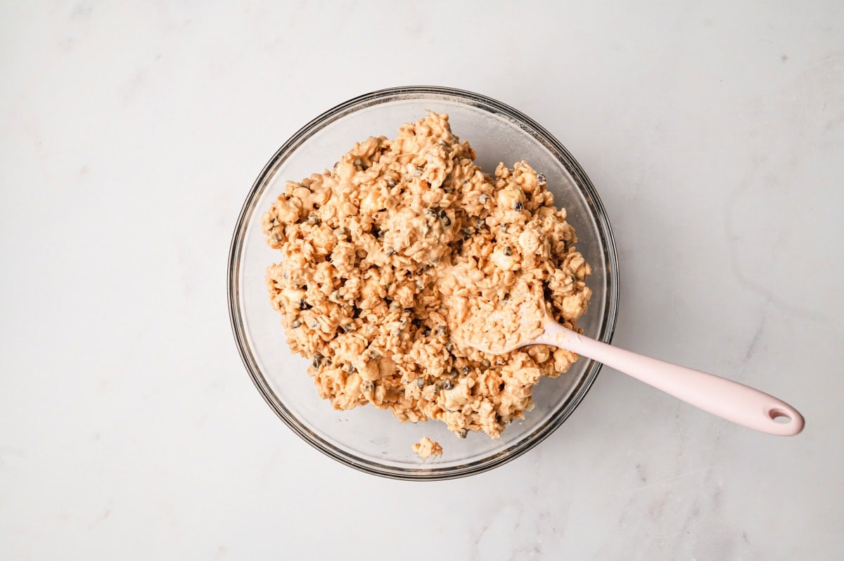 Rice cereal mixture after being stirred into the peanut butter white chocolate mixture for avalanche cookies.