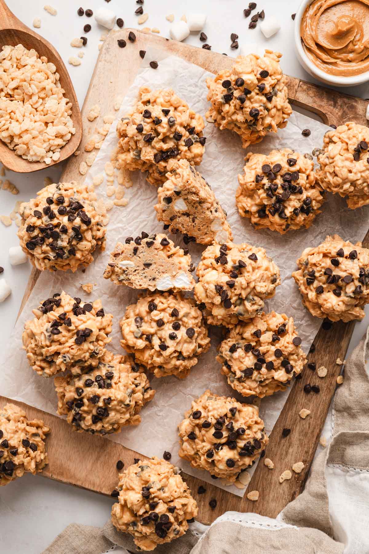 Avalanche cookies on a cutting board with chocolate chips on top.