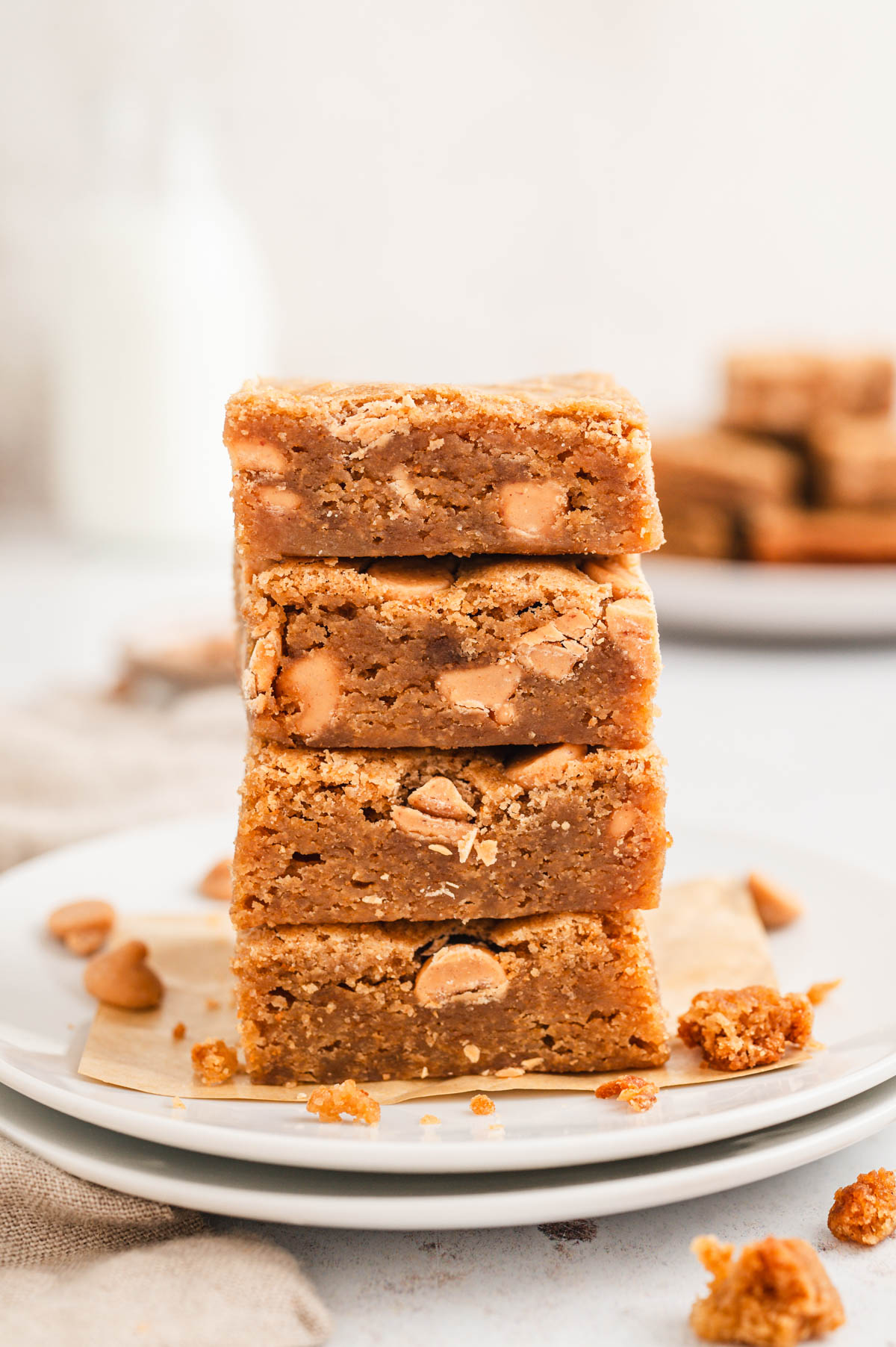 Stack of blondies on a white plate.
