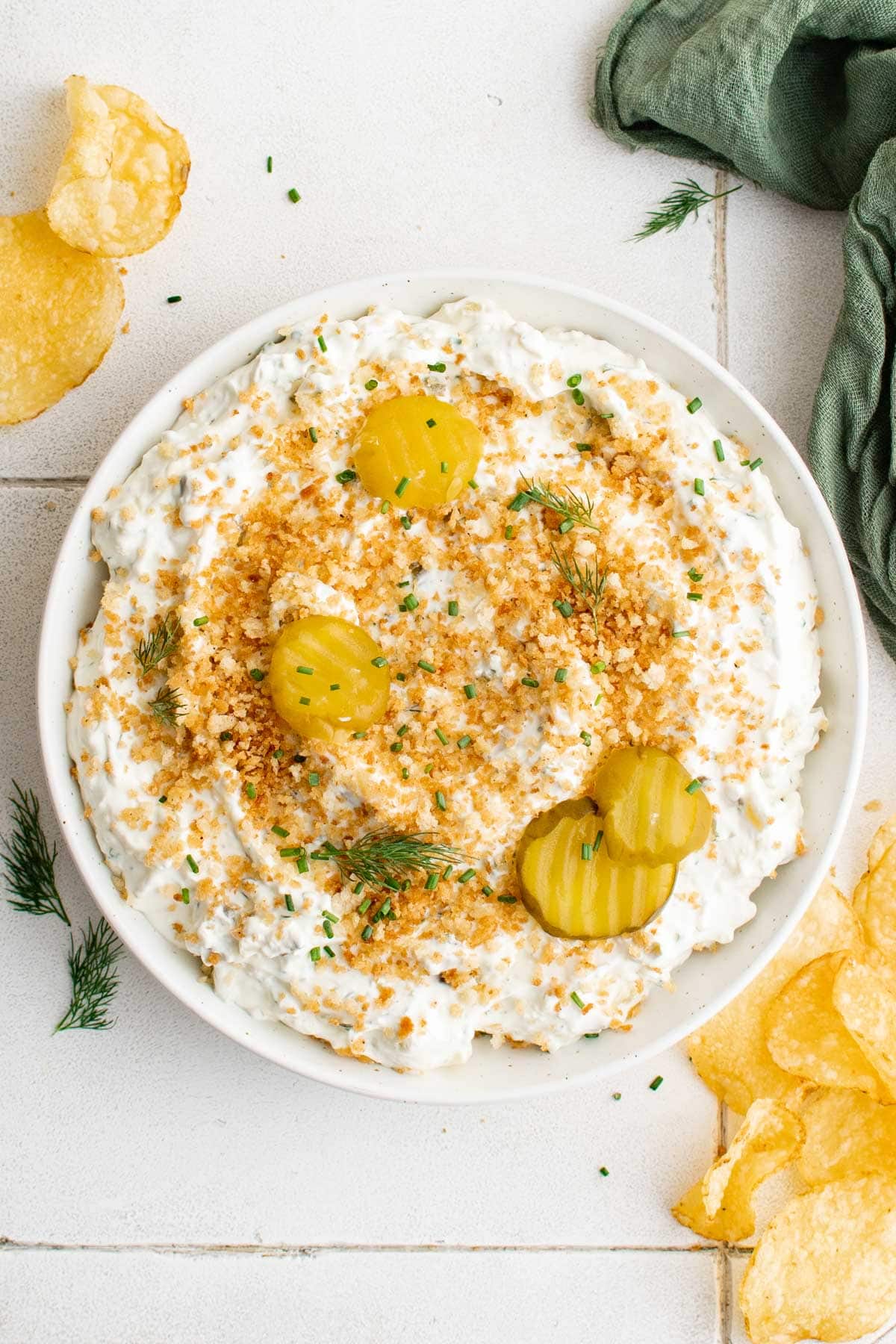 Fried pickle and ranch dip with breadcrumbs.