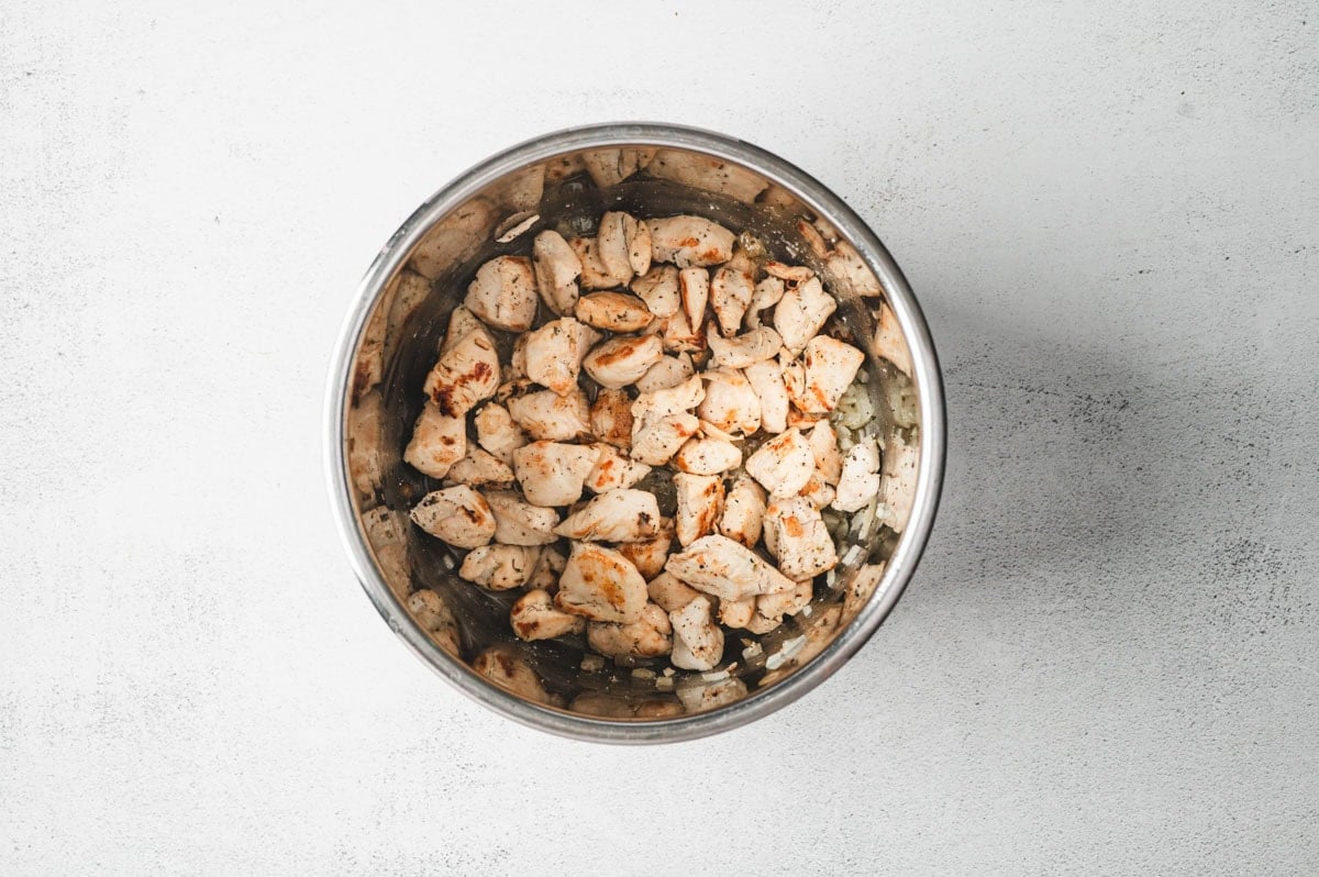 Chicken in the Instant Pot after being browned.