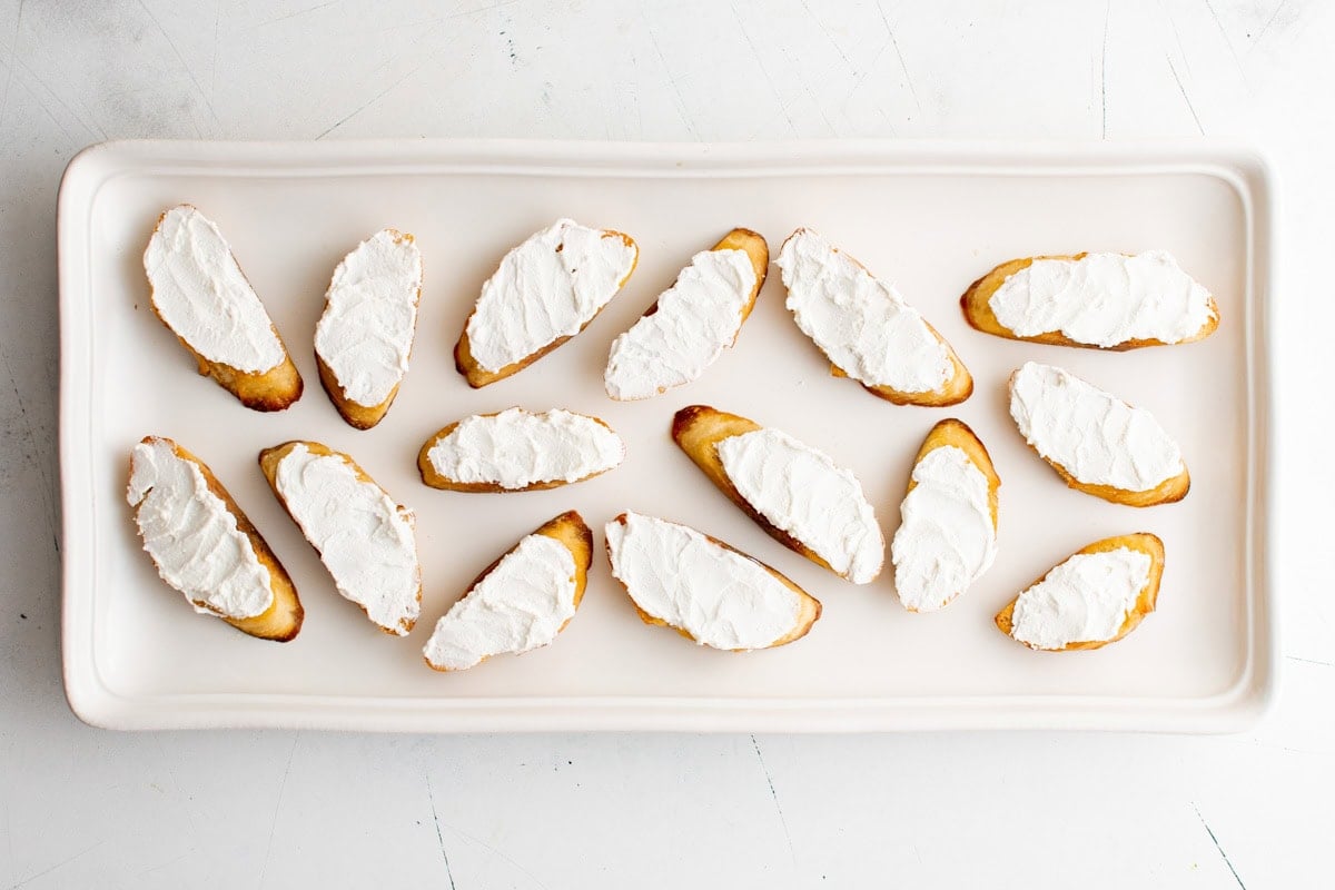 Goat cheese spread on toasted bread.